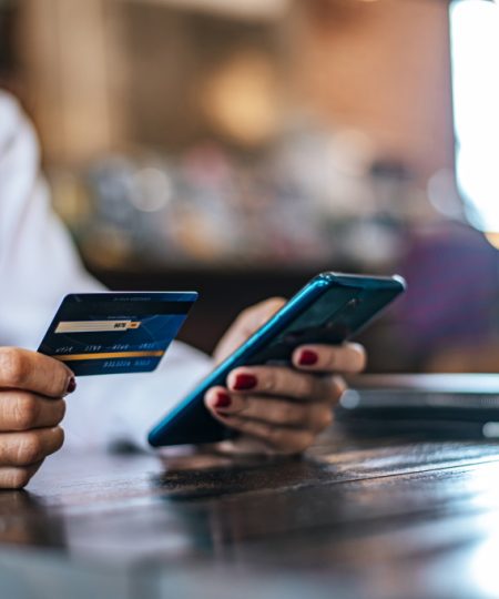 pay-goods-by-credit-card-through-smartphone-coffee-shop.jpg